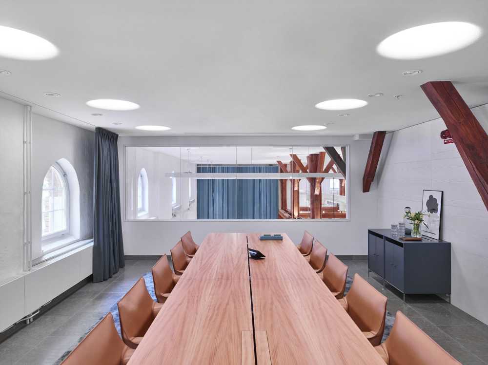 Meeting room with salmon colored tables and chairs